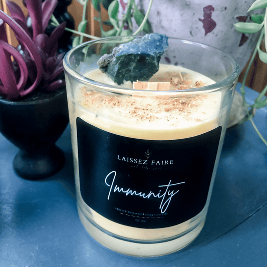 image of Immunity candle, yellow wax, wooden wick, and Bloodstone crystal